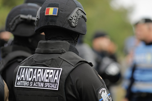 Sarulesti, Romania - September 22, 2022: Details with anti terrorist brigade of the Romanian jandarmi (riot police) during a police raid for illegal waste management..