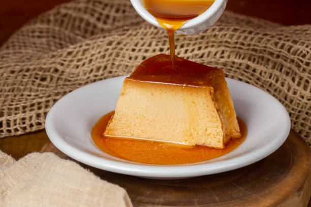 istock caramel syrup pouring over milk pudding slice. 1426234526