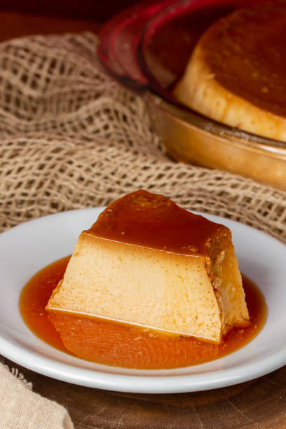 istock caramel syrup pouring over milk pudding slice. 1426234561
