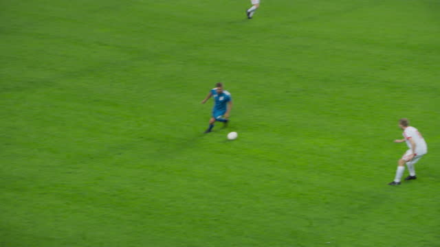 Soccer Football Match Event on a Major League Championship: Blue Team Attacks, Playing Pass, Dribbling. International Cup. Live Sport Channel Broadcast Television Playback. Slow Motion