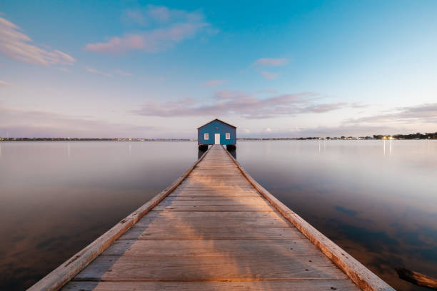 istock Sunset, jetty, and blue boat house in Perth, Western Australia 1426237087