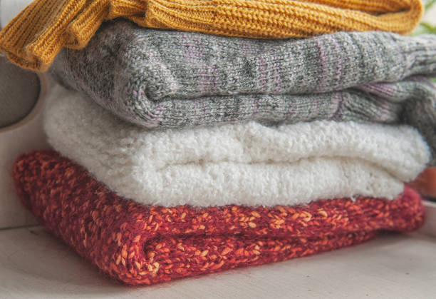 istock Autumn and winter background with knitted colourful sweaters 1426241977