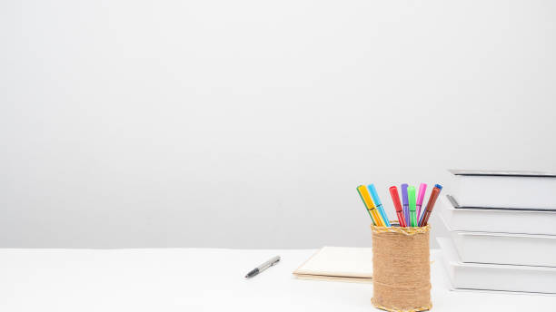 istock Pencil box pen books on the table copy space white background 1426242050