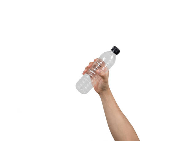 istock Man hand holding water bottle plastic trash white isolated 1426242096