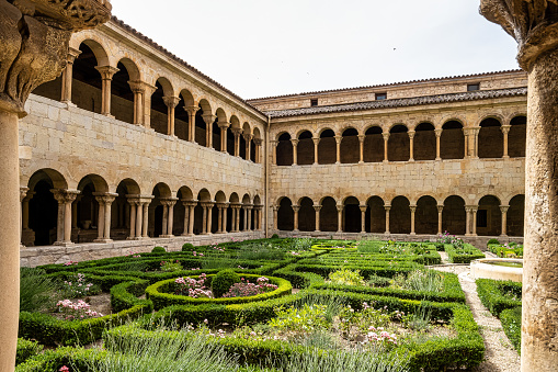 The cloister of Santo Domingo de Silos Abbey at Burgos, Spain. It is a Benedictine monastery and a masterpiece of Romanesque art.