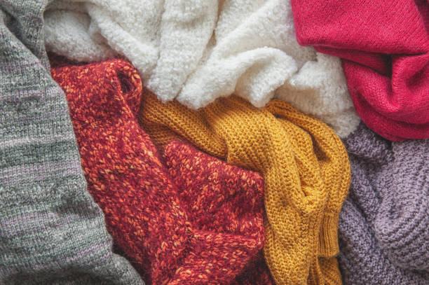 istock Autumn and winter background with knitted colourful sweaters 1426243187