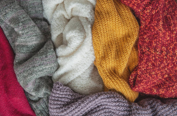 istock Autumn and winter background with knitted colourful sweaters 1426245007