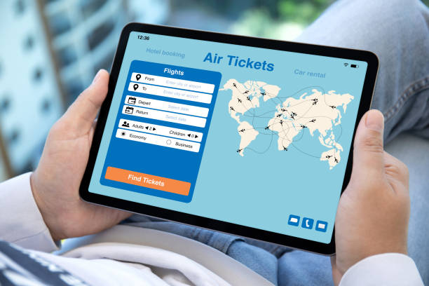 istock male hands holding computer tablet with application searching air tickets 1426245262