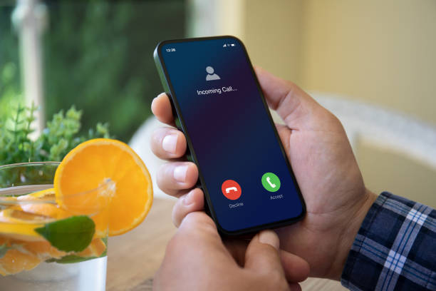 istock Man hands holding phone with incoming call on the screen 1426247755