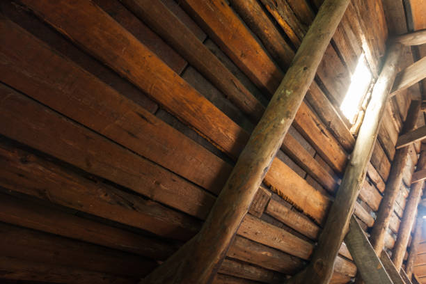 Abstract grunge wooden interior, glowing light window in an attic room