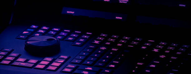 istock Edit video production control panel in studio. Editor editing and grade film in movie post room. Telecine control machine and man hand editing or adjusting color on digital video in post production. 1426249447