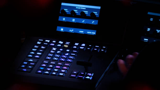 istock Edit video production control panel in studio. Editor editing and grade film in movie post room. Telecine control machine and man hand editing or adjusting color on digital video in post production. 1426249548