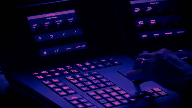 istock Edit video production control panel in studio. Editor editing and grade film in movie post room. Telecine control machine and man hand editing or adjusting color on digital video in post production. 1426249640
