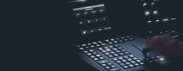 istock Edit video production control panel in studio. Editor editing and grade film in movie post room. Telecine control machine and man hand editing or adjusting color on digital video in post production. 1426249674