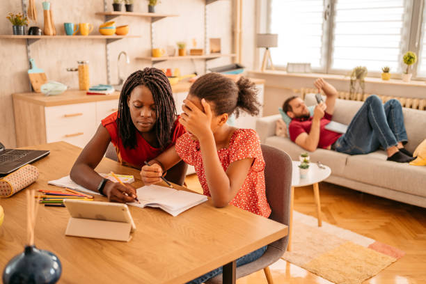istock Young Mother Helping Daughter With Homework 1426249816