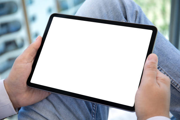 istock male hands holding computer tablet with isolated screen in office 1426250174