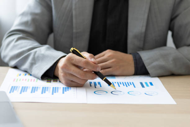 istock Businessman analyzing company financial documents and market growth reports. 1426251903
