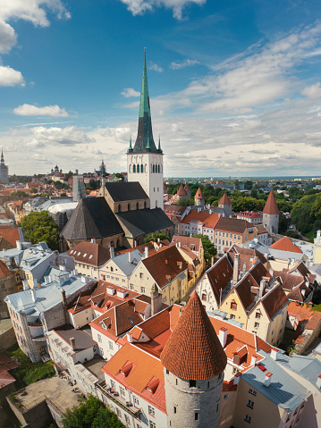 Aerial view of towers and house in the old town of Tallinn in summer. The church is St Olaf's church founded in the 12th century.