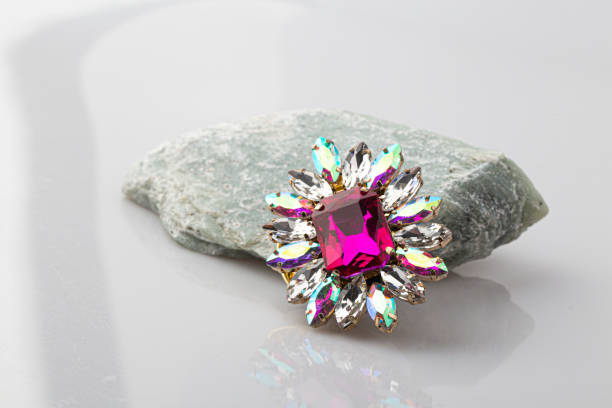 istock antique brooch purple stone on white background. 1426252628