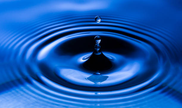 istock Macro water drop,Blue splash water droplets round water droplets in glass drops, splashes, sprays, abstract shapes out of water 1426252668