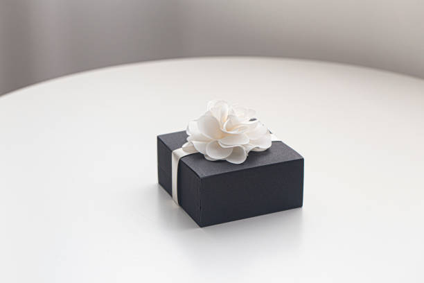istock Small black jewelry box on white tabel. 1426253700