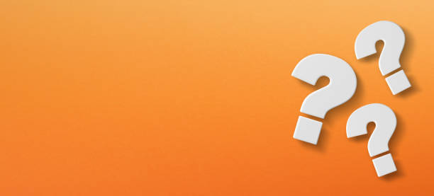 Question mark with copy space on a orange background stock photo