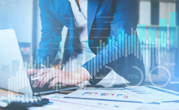 istock Businessman analyzing for financial and investment growing graph by digital augmented reality graphics 1426257596