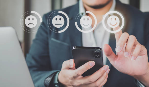 istock Customer review good rating concept hand pressing five star and smile face icon on visual screen for positive customer feedback testimonial. 1426257601