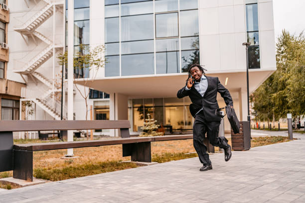 istock Businessman running late to work 1426259164