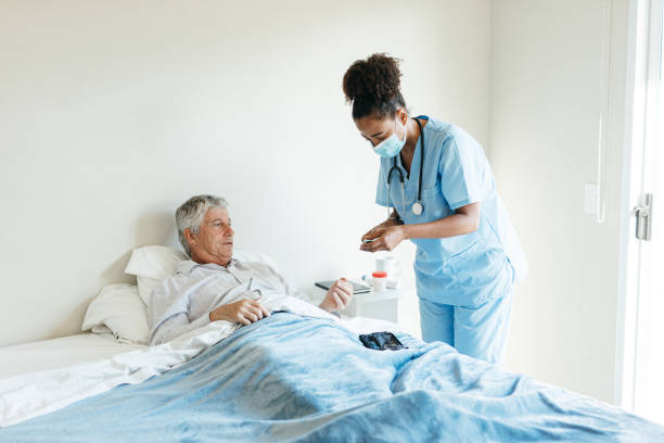 istock Nurse visiting diabetic senior man at home 1426260649
