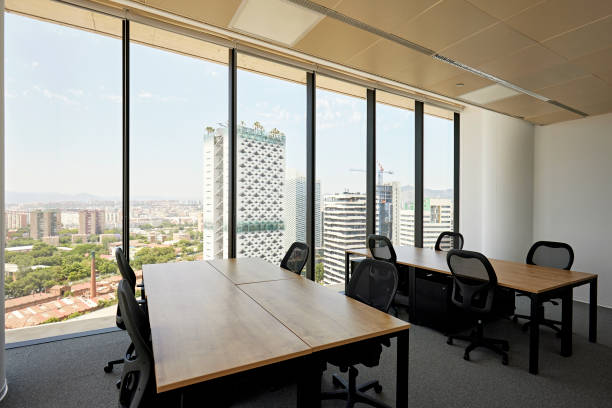 istock Modern coworking environment and city view 1426261264
