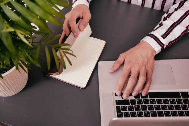 istock Cheerful funny student with a laptop. 1426262032