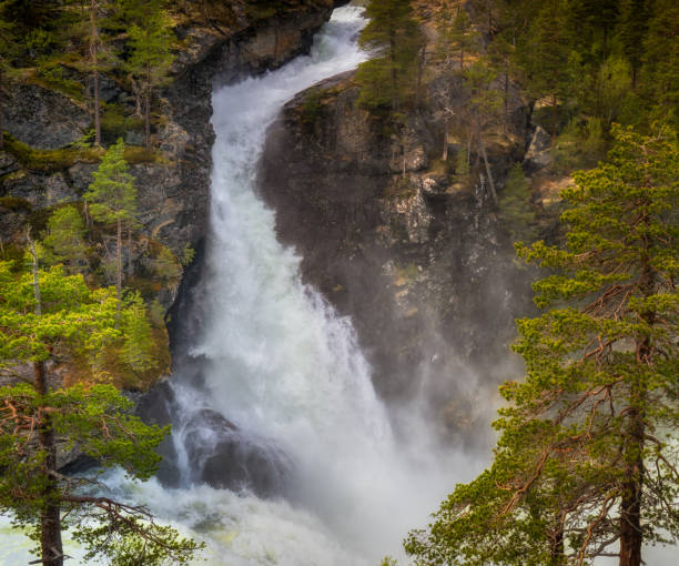 istock Kleivafossen or Colliding Waterfall, a beautiful waterfall in Norway with mountain views 1426264407
