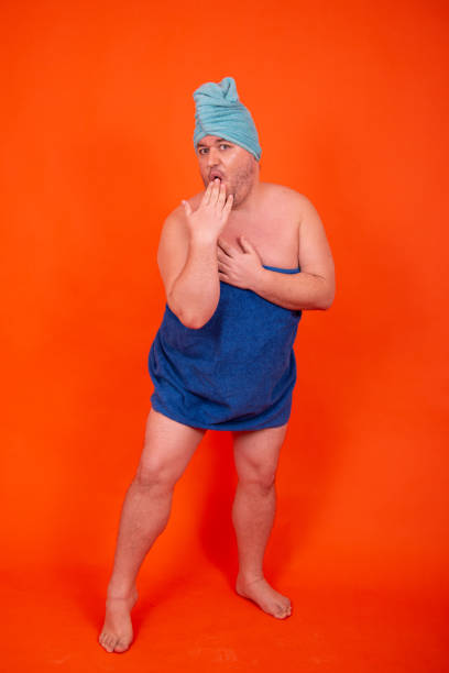 istock Funny guy takes a shower. Drag queen is wet. 1426268046
