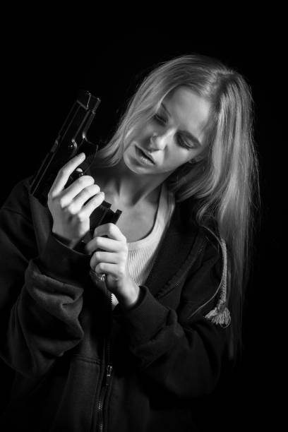 istock girl with gun 1426269225