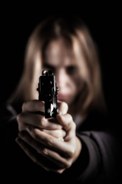 istock girl with gun 1426269266