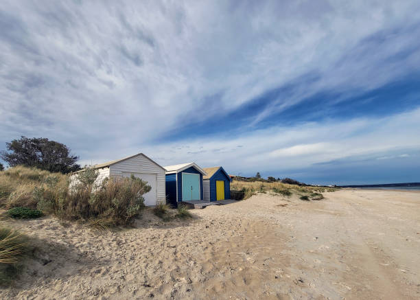 Beach huts on Chelsea beach overlooking Port Phippip Bay