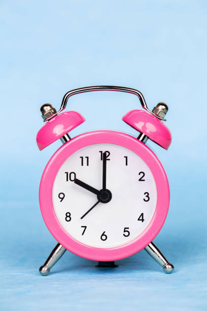 istock Alarm clock on a blue background, daylight savings time 1426274860