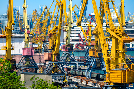 industrial seaport infrastructure, sea, cranes, buildings and ships, concept of maritime cargo transportation