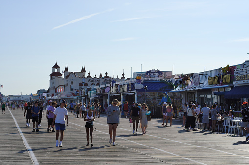 Point Pleasant Beach, NJ, USA - June 15th, 2022; Families, youth, locals and visitors are amongst thousands enjoying a summer vacation at the Point Pleasant Beach, NJ Boardwalk and at one of the numerous popular shore towns along the East-coast of the USA.
