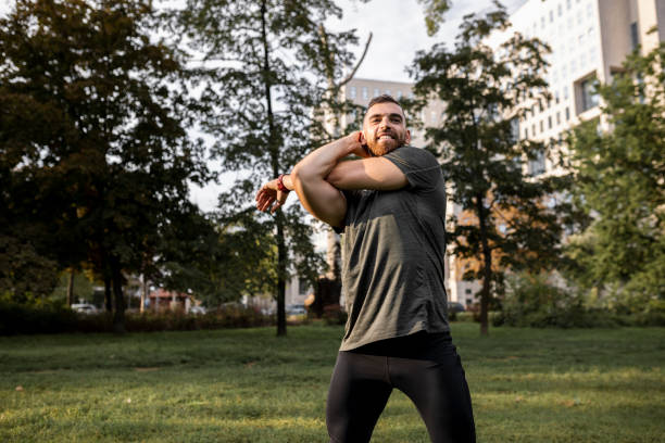 istock Shot of a young man stretching before a run 1426284688