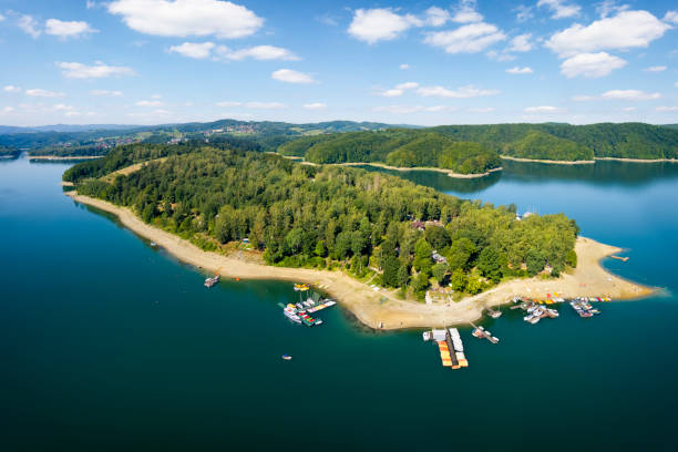 Vacations in Poland - Lake Solina Vacations in Poland - Lake Solina with Bieszczady Mountains in background bieszczady mountains stock pictures, royalty-free photos & images
