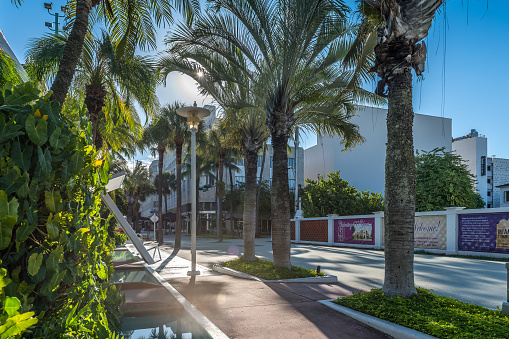 Miami Beach, USA – September 22, 2022: Quiet and lonely morning on Miami Beach's famous Lincoln Road shopping street. It hosts a pedestrian mall replete with shops, restaurants, galleries, and other businesses.