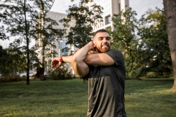 istock Shot of a young man stretching before a run 1426288184