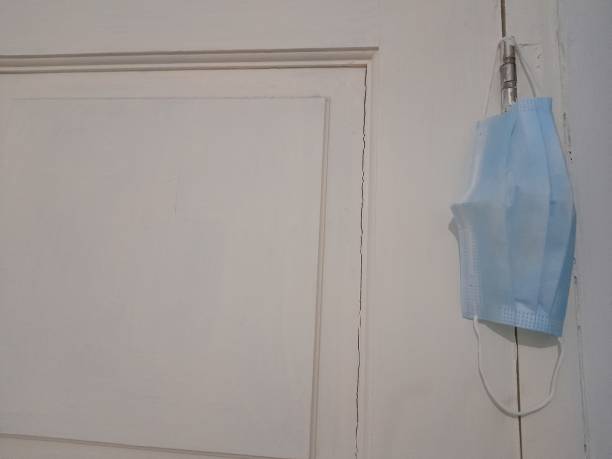 istock blue mask hanging on the door 1426291675