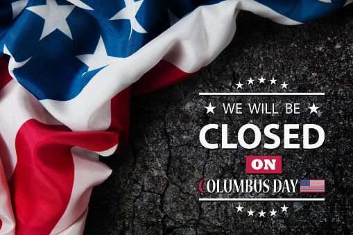 Columbus Day Background Design. American flag on a stone wall with a message. We will be Closed on Columbus Day.