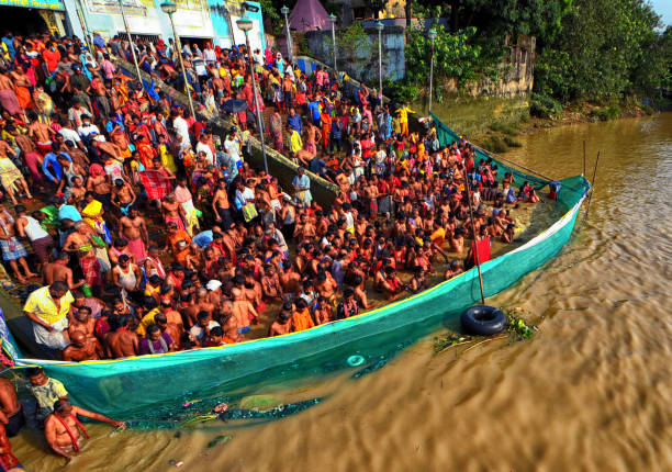 istock Hindu devotees seen in River Ganges offering their prayers to their Ancestors as guided by the Priest during the Mahalaya celebration . 1426292152