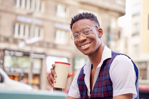 istock stylish man drinking coffee in the street 1426292758