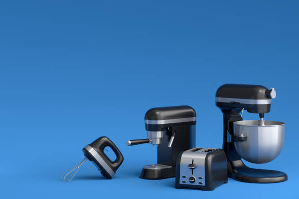 istock Espresso coffee machine, hand mixer, kettle and toaster on blue background. 1426293097