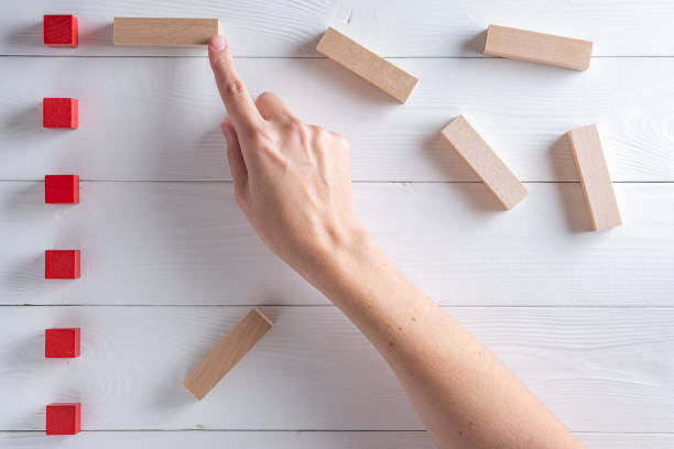 istock Close up of analyst hands point at charts on board. Concept of analytical data 1426293922